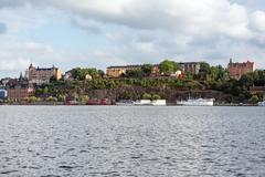 Mariaberget with Mariahissen, Ivar Los park, Mälarborgen, and hotel boats Den Röda Båten, Ran af Stockholm, and Rygerfjord at Riddarfjärden, Södermalm, Stockholm