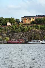 Mariaberget with Ivar Los park and hotel boats Den Röda Båten, Ran af Stockholm, and Rygerfjord at Riddarfjärden, Södermalm, Stockholm, Sweden