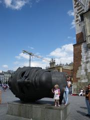 Head of Eros statue in the main market square in Krakow