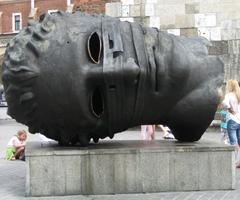 Igor Mitoraj's Eros Spętany sculpture displayed outdoors