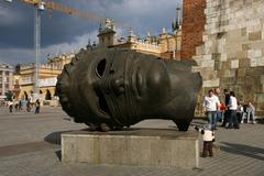 Igor Mitoraj sculpture Eros Bendato at Kraków marketplace