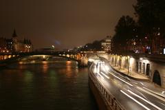 Pont Notre-Dame at night with birds flying