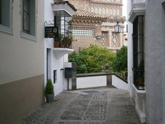 A traditional street in Poble Espanyol, Barcelona, featuring a leather workshop