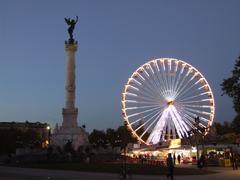 Colonne aux Girondins and Ferris wheel at night, Place des Quinconces, Bordeaux, France