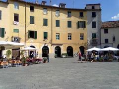 Scenic view of Lucca, Province of Lucca, Italy with historic buildings and lush greenery