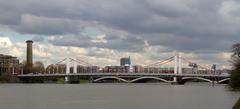 Chelsea Bridge over the Thames River with cityscape