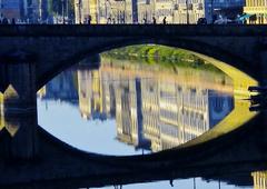 Panoramic view of Florence cityscape with historic buildings and Arno River at sunset