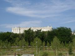 Parque de Madrid Río with a view of the western facade of the Royal Palace and Campo del Moro