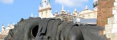 Renaissance Sukiennice and modern sculptures in Main Market Square, Cracow