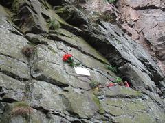 Memorial plaque for climbers on a rock face