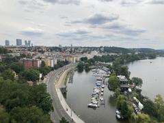 Panoramic view of Prague with landmarks including Charles Bridge and Vltava River