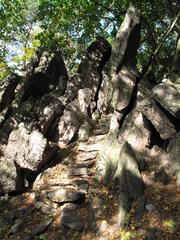 Scenic view of Babí lom with rocky terrain and dense forest