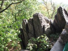 Panoramic view of Babí lom with scenic cliffs and lush greenery