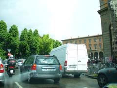 Piazza della Libertà in Florence with historical buildings and traffic