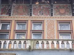 Stone balcony with arches and triple windows at Vajdahunyad Castle