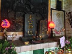 Altar with Chinese inscriptions and offerings