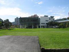 Dahu Park Station Exit 2 and adjacent grass field