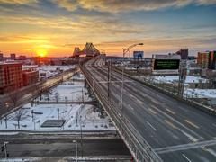 Pont Jacques-Cartier at night with curfew message sign in Montreal