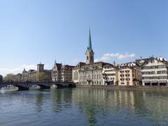 View of Fraumünster Church with Münsterbrücke and Limmat River in Zurich, Switzerland