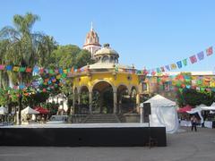 Tlaquepaque town square with colorful buildings and people, 2021