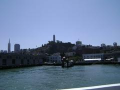 view of Coit Tower from the ferry to Alcatraz Island in San Francisco Bay