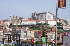 Scenic view from Vila Nova de Gaia quayside across Douro River towards Porto Cathedral district with Dom Luís I Bridge in view