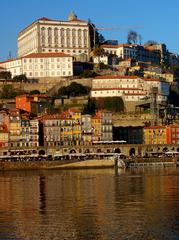 view of Porto, Portugal with the Douro River and traditional boats