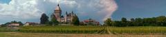 Vufflens Castle with vineyards and Swiss Alps