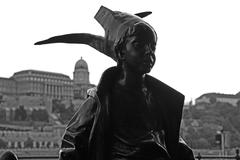 Little Princess statue on the Danube promenade in Budapest