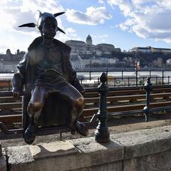 Little Princess Statue on Danube promenade railings in Budapest Hungary