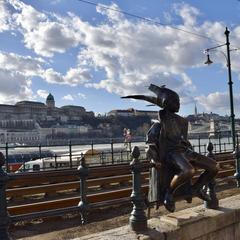 Little Princess Statue on the Danube promenade in Budapest, Hungary