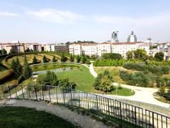 View of Collina della 'preistoria', water mirror, and part of 'history' from the top of Collina del 'presente' in Parco del Portello, Milan