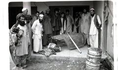 Afghans showing canopy of downed Soviet jet, 1984