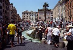 Tourists at the Barcaccia fountain in Rome