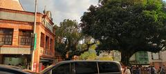 Shenkeng Old Street entrance with a large Bishop Wood tree landmark