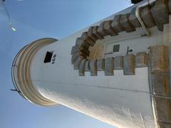 Cape D'Aguilar Lighthouse at dusk with clouds in the sky