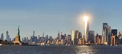 Sun reflecting off the Freedom Tower at sunset