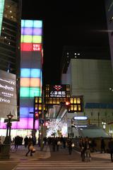 Dotonbori at night with illuminated billboards and reflections on the canal in Osaka, Japan