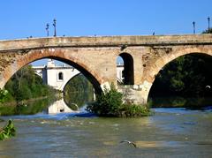 Ponte Milvio and bridge over a shallow wide river