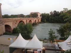 Ponte Milvio bridge in Rome at sunset