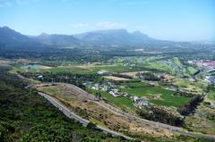 Ou Kaapse Weg view of Steenberg wine farm, Pollsmoor Prison, US Consulate, Constantia, and Table Mountain