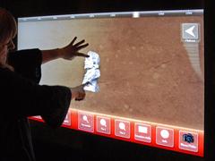 Interactive touchless screen at eSpace exhibition with 3D objects