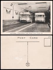 Two buses crossing the Detroit-Windsor Tunnel in a vintage postcard from 1945