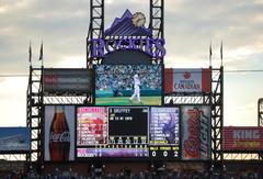 Coors Field main scoreboard at night