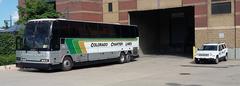 Colorado Charter Lines bus and security vehicle at Coors Field