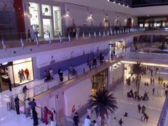 The Dubai Mall exterior view with people walking around