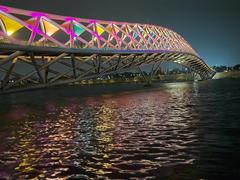 Sabarmati riverfront and Atal Pedestrian Bridge at night with colorful lighting