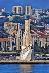 The Monument to the Discoveries in Lisbon under a clear blue sky