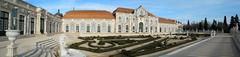 Palácio Nacional de Queluz surrounded by a lush garden