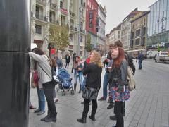 Brno Astronomical Clock with German tourists at Náměstí Svobody square